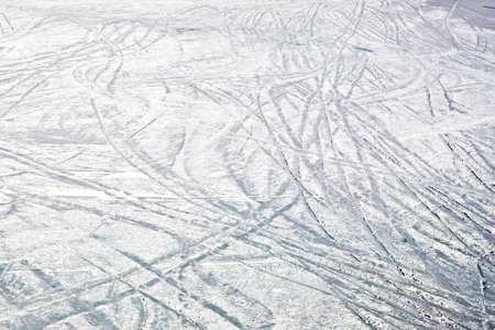 ski slope with ice from skiers and snowboarders in the alps