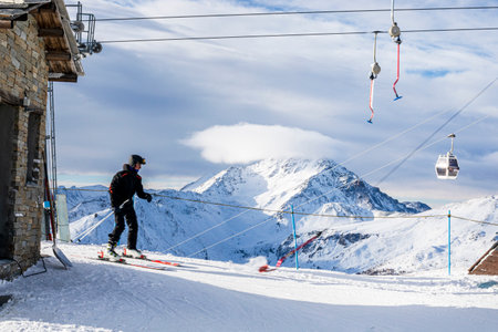 view of the evening mountain peaks and T-bar lifts in the Alpsの写真素材