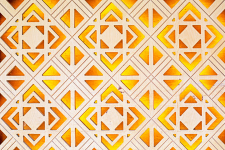 decorative carved pattern from wood illuminated from the insideの写真素材
