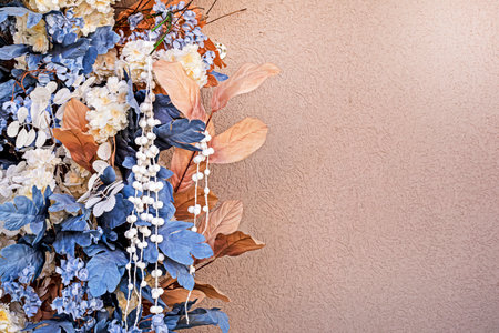 ikebanas made of flowers on a beige background with a surveillance camera. Color of the yearの写真素材