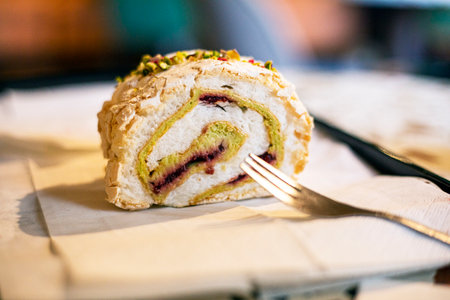 taste meringue roll with pistachio and raspberry. Popular dessertsの写真素材