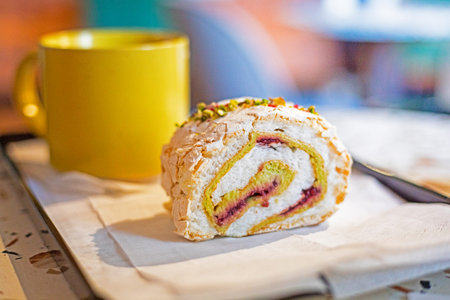 taste meringue roll with pistachio and raspberry and ginger tea. Good morning. Popular desserts