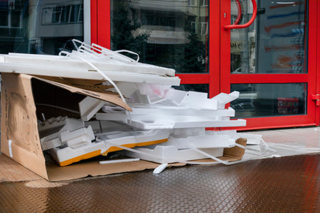scattered remains of packaging near the office door