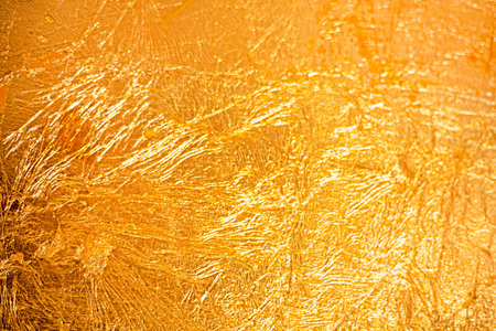 beautiful golden textured background of the coating in the interiorの写真素材