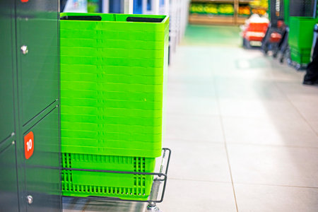grocery greens baskets for products at the entrance to the supermarketの写真素材
