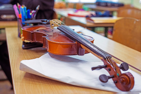 master violin with bridge close-up on table in music classの写真素材