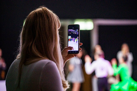 shooting on smartphone latin american couple dance of childrenの写真素材