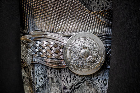 ancient gray fabric with metallic silver beltの写真素材