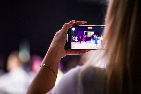 shooting on smartphone latin american couple dance of childrenの写真素材