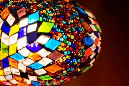 stained glass lamp on a dark background with a geometric pattern