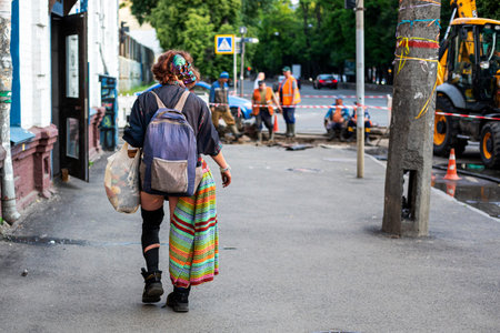 stylish hippie girl walks around the city during the day. Authenticityの写真素材