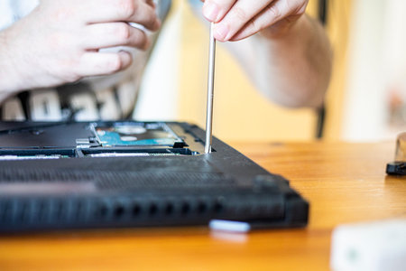 unscrew with a screwdriver and remove the base of the laptop to eliminate the malfunction