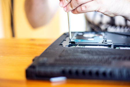 unscrew with a screwdriver and remove the base of the laptop to eliminate the malfunction