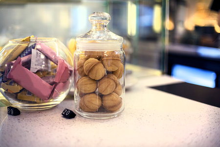 shortbread round cookies in the shape of nuts in a glass organizerの写真素材