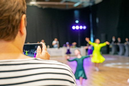 video of a ballroom dance tournament with sport dancing on a smartphoneの写真素材