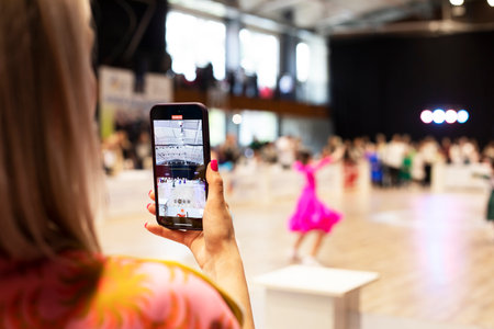 record on smartphone video of the ballroom dancing tournament with sport dancingの写真素材