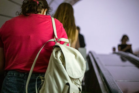 people in the subway going up and down the escalatorsの写真素材