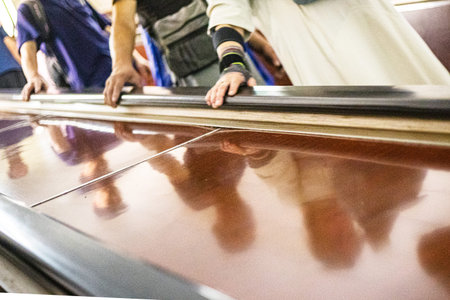 going down the escalator in the metro and holding on to the handrails
