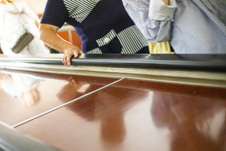 going down the escalator in the metro and holding on to the handrails