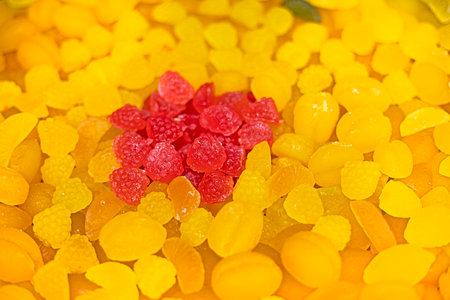jelly candies in raspberry and lemon shapes in a confectioneryの写真素材