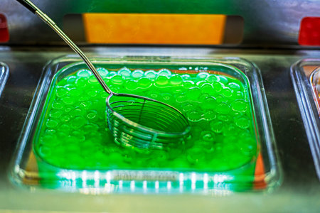 close-up green sweet and sour filling for making bubble tea