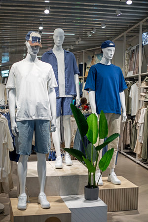 modern stylish seasonal men's clothing in a shopping centerの写真素材