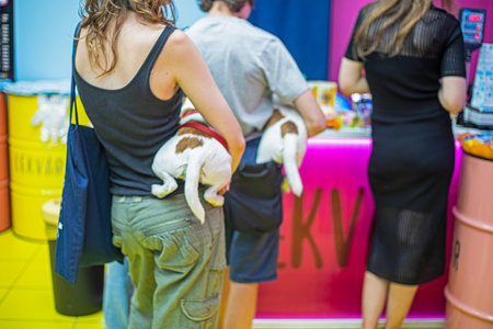 standing in line at the checkout with pets dogs jack russell terrier in armsの写真素材