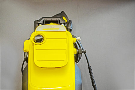 part of vacuum cleaner on gray background. Cleaning company