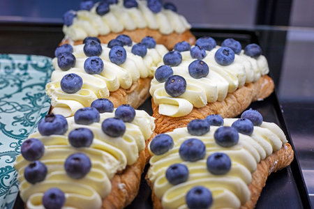 blueberry tatry with cream in the confectionery departmentの写真素材