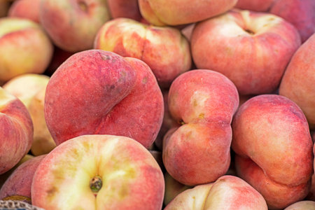 Close-up of fig peaches in a container in a supermarket. Seasonal fruitの写真素材