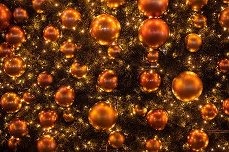 New Year Christmas background of golden decorative balls on a Christmas tree
