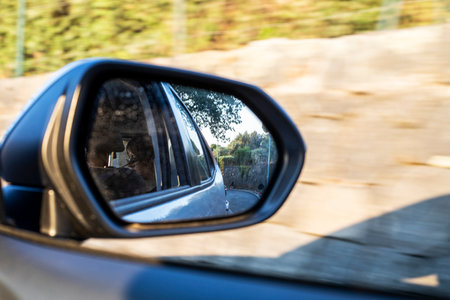 photograph through the right mirror of the car. Traveling by carの写真素材
