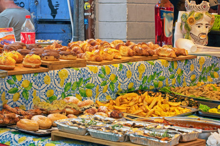 fried potato slices and other products at the markets in Sicily. Italy travelの写真素材