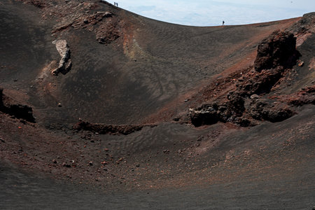 huge crater with volcanic rocks on Mount Etna. Traveling in Italyの写真素材