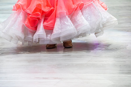 young dancer in a pink and white dress dances a standard dance program on the floor, 10 dancesの写真素材