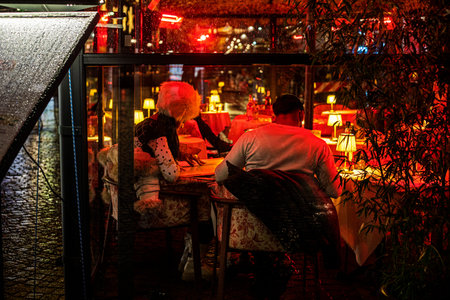 cozy cafe with red lanterns on a rainy day