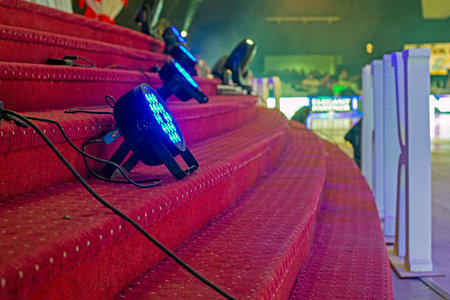 Brightly lit stage lighting and decorations at the dance tournamentの写真素材