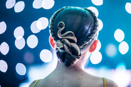 Beautiful, stylish slicked-back hairstyle with a curl for the junior class.の写真素材