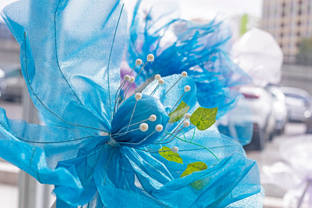 Artificial decorative blue flowers in interiorsの写真素材