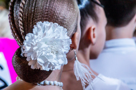 girl's stylish modern hairstyle before a ballroom dance competitionの写真素材