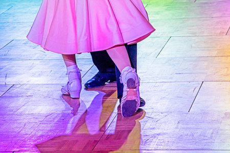 young pair of juvenile dancers on the dance floor during a dance.の写真素材