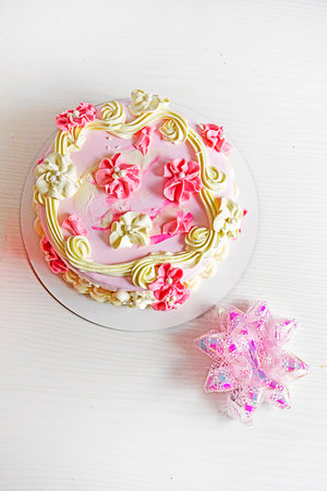 a cake with flowers on a light background. Women's Day, congratulations.の写真素材