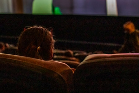Moviegoers before watching a movie in a theater.の写真素材
