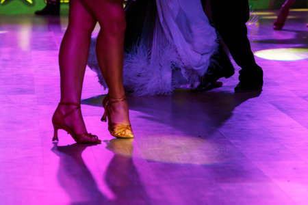 Dancers in bright, beautiful dresses practicing on the dance floorの写真素材