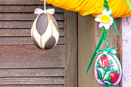 Painted pysankas on a wooden background. Easter holiday