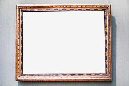 Decorative carved profile frame on a gray background. Mockup for your inscriptions and advertising.