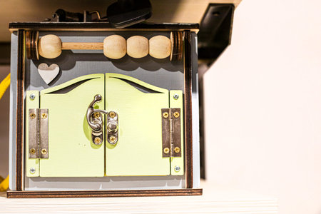 Educational wooden toy with locks and beads for counting