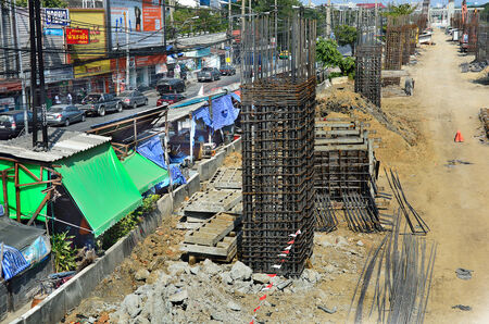 The construction of the highway near the community Sewing pole line from the creation of the post Expressway. shot this photo on 2015-1-1 , in Bangkok Thailand.のeditorial素材