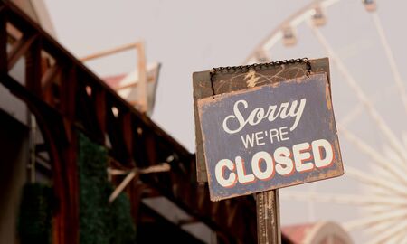 Signs sorry, we closed a vintage image of a restaurant in the parkの写真素材