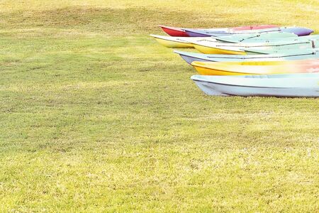 Canoeing the many colorful arranged on the lawn vintage retro image.の写真素材